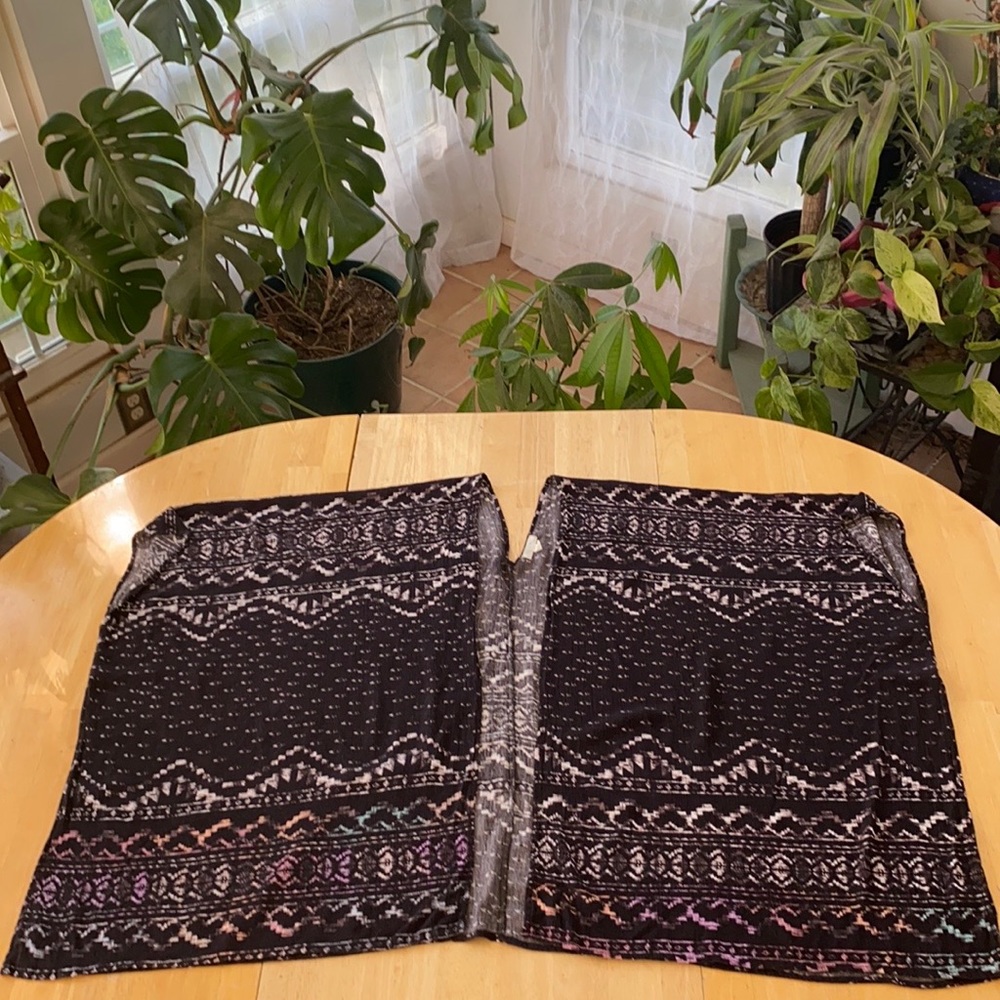 FREE TO FLY. Size Small Open Black Rayon Poncho w/Front blue/pink/purple design.